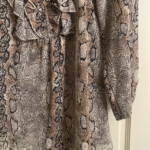 Puffy sleeves,ruffles 1/2 way down front opening. 100% polyester. - Picture 2 of 7